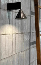 Elrovan wall sconce, black, lifestyle on tiled wall