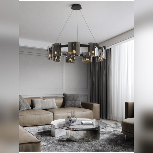 Kelrix chandelier in Smoke Grey glass above a living room dining table