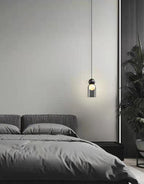 Modern Glass Bubble Pendant Light – Qaevorn – Capsule Shape, Matte Black & Smoked Glass – Bedside Lifestyle