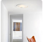 Xelion flush-mount ceiling light in a minimalist corridor