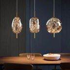 Astrelle Starlit Glass Pendant Light – lifestyle over dining table, Oval Cylinder and Sphere shapes