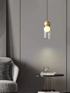 Modern Glass Bubble Pendant Light – Qaevorn – Capsule Shape, Brushed Gold & Clear Glass – Living Room Lifestyle