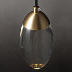 Ovaline pendant light close-up, hand-blown glass and brass