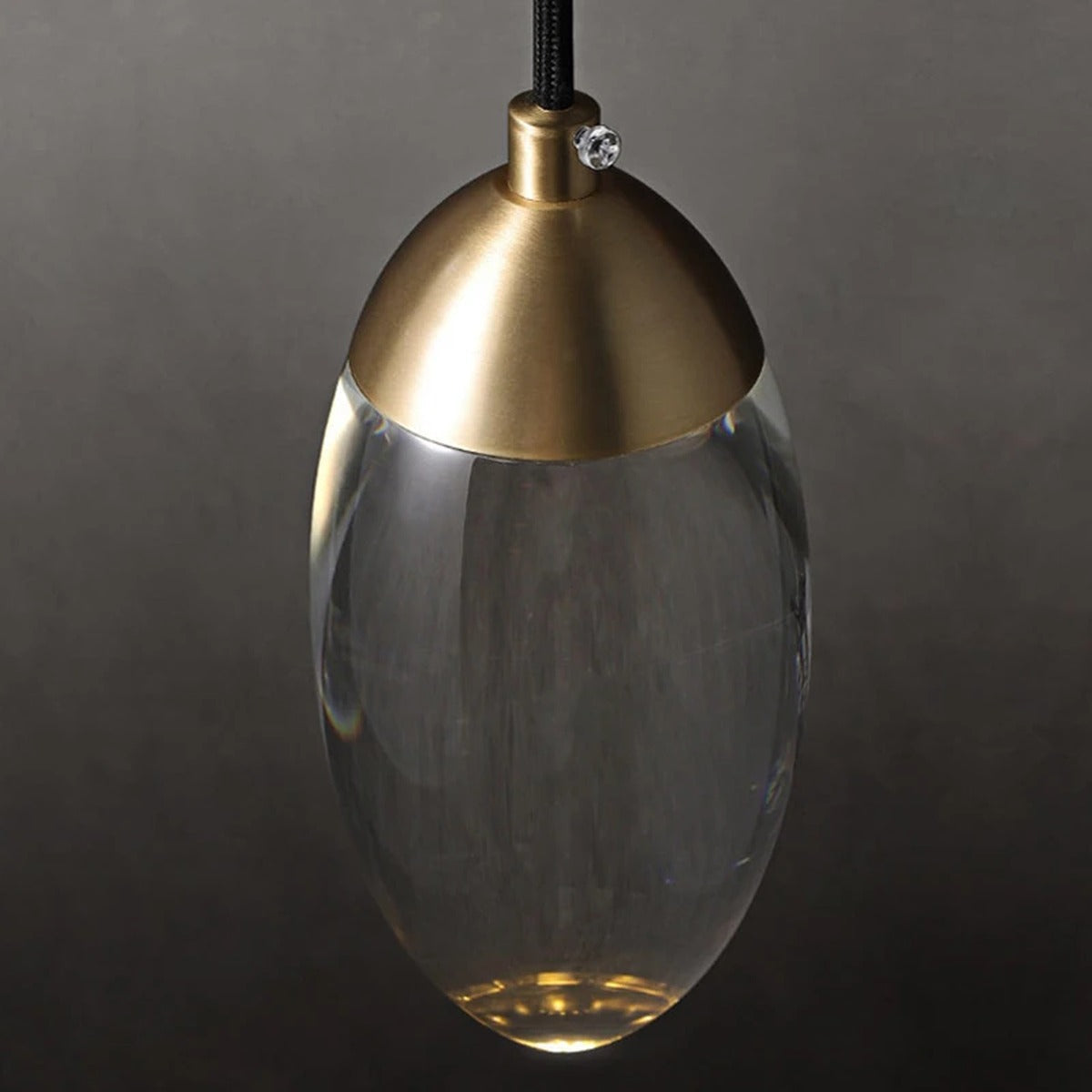 Ovaline pendant light close-up, hand-blown glass and brass