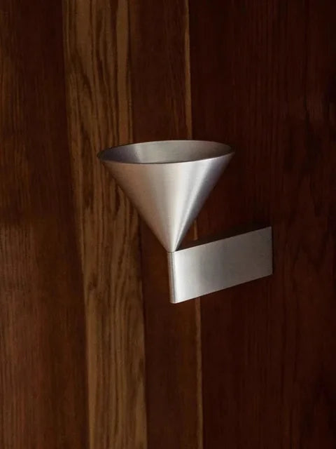 Elrovan wall sconce, silver, detail on wood panel