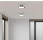 Velmora chrome ceiling light installed above a living room seating area