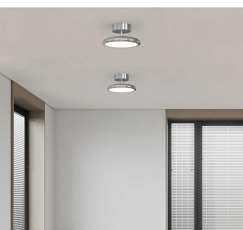 Velmora chrome ceiling light installed above a living room seating area