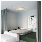 Xelion ceiling light above a bedroom sleeping area
