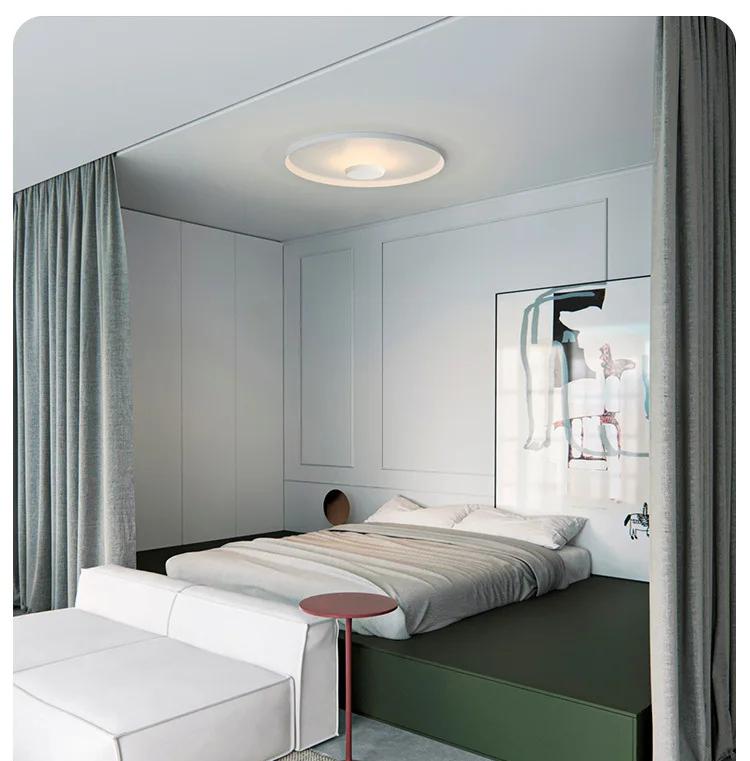 Xelion ceiling light above a bedroom sleeping area