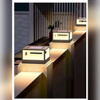 Ferronex pillar cap light installed on garden fence posts at night, warm glow