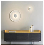 Xelion wall-mounted in two sizes above a console