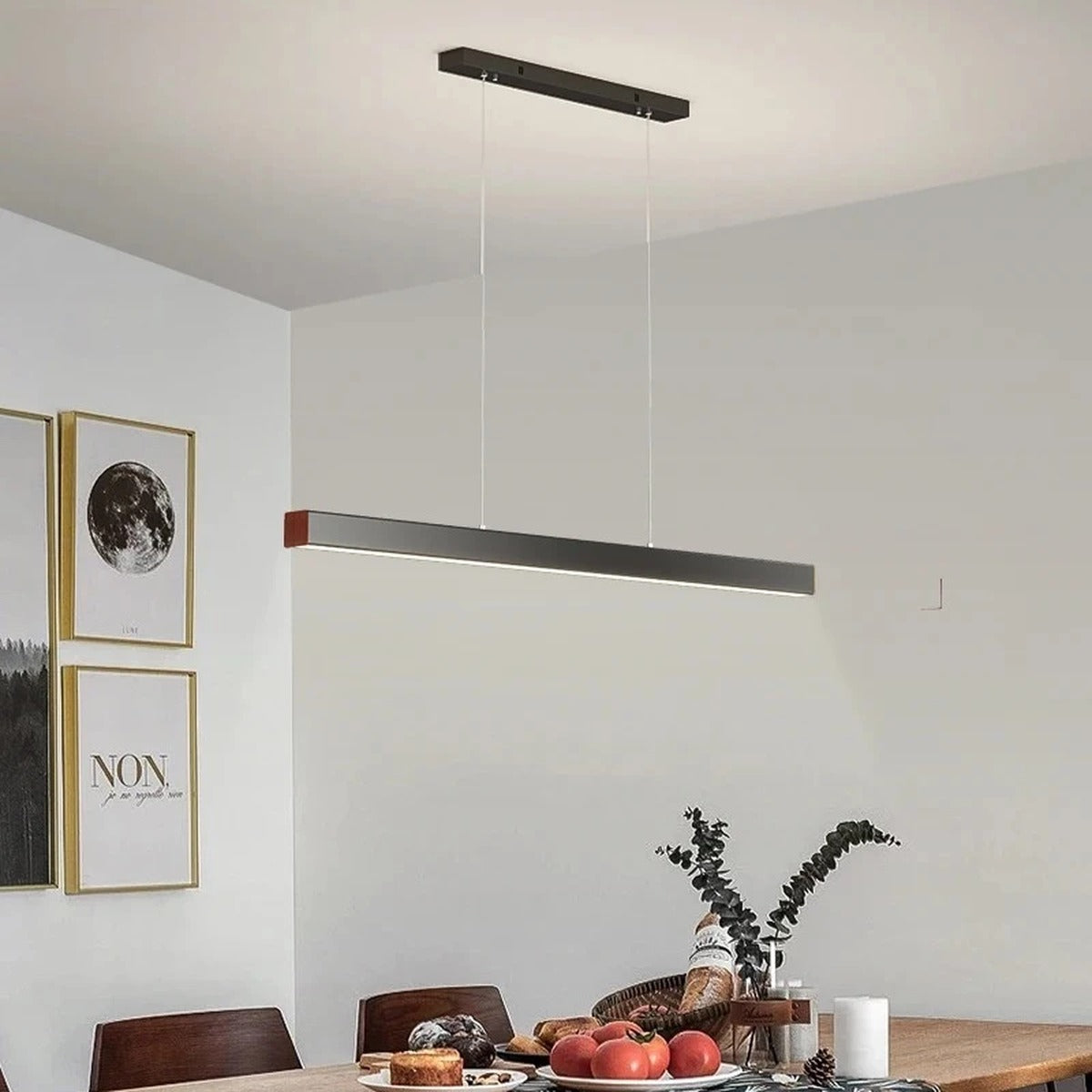 Linexa Black LED Bar Pendant Light over a breakfast table
