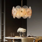 Iralux round drum chandelier above a marble dining table