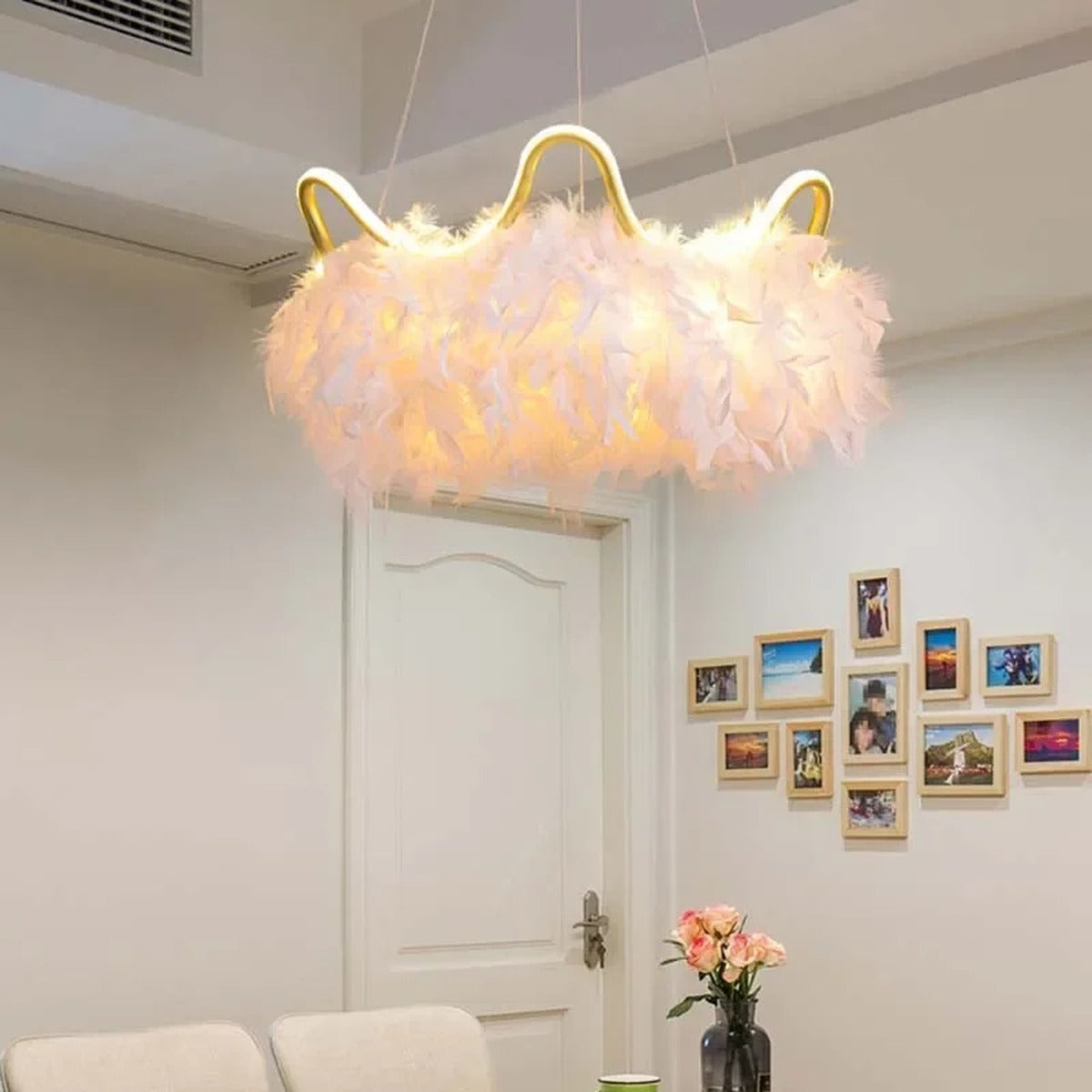 Jevon white feather halo chandelier — dining entryway lifestyle view above white door
