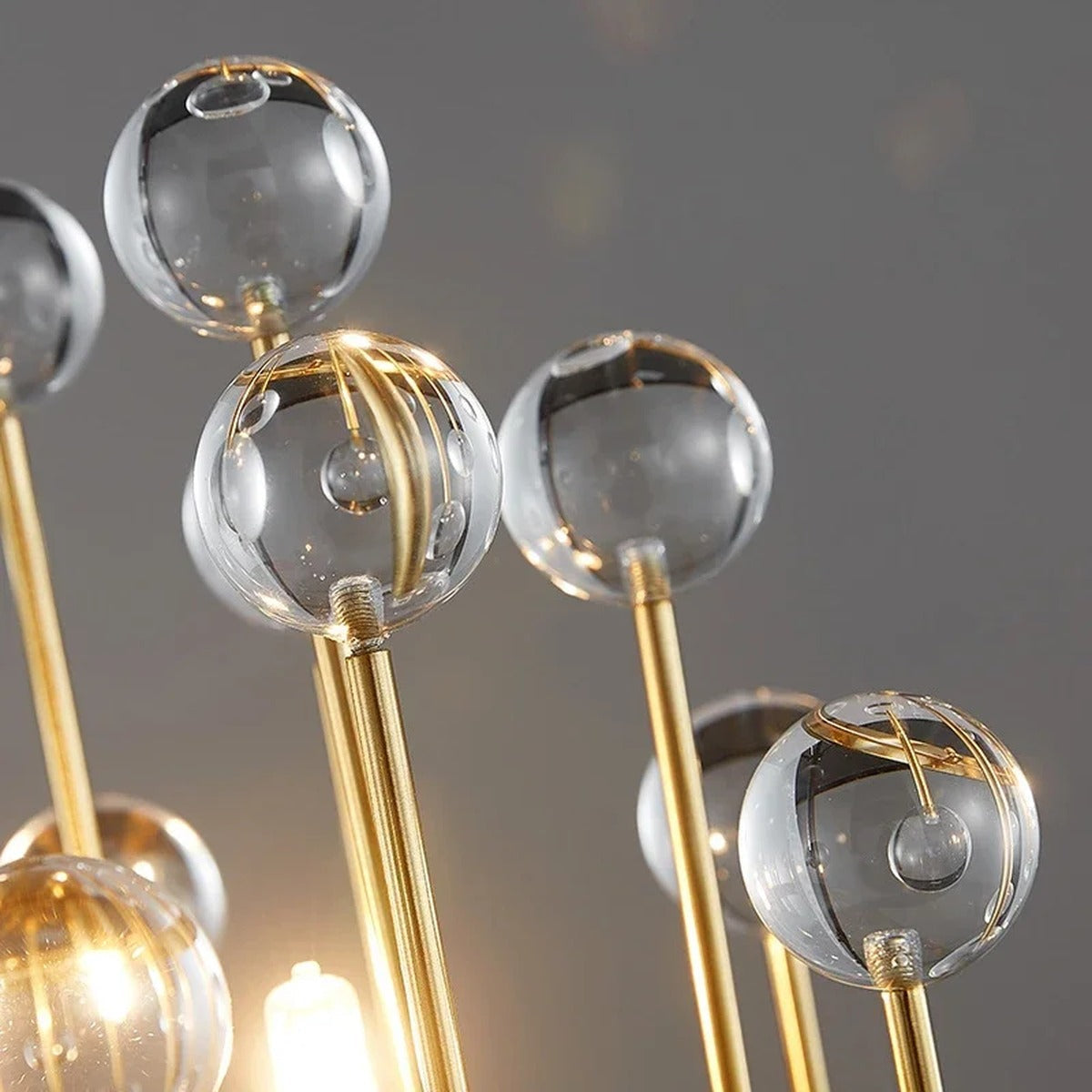 Detail of Morvena Clear Sphere Crystal glass orbs catching warm light