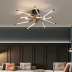Solendra matte black starburst chandelier over dark living room wall