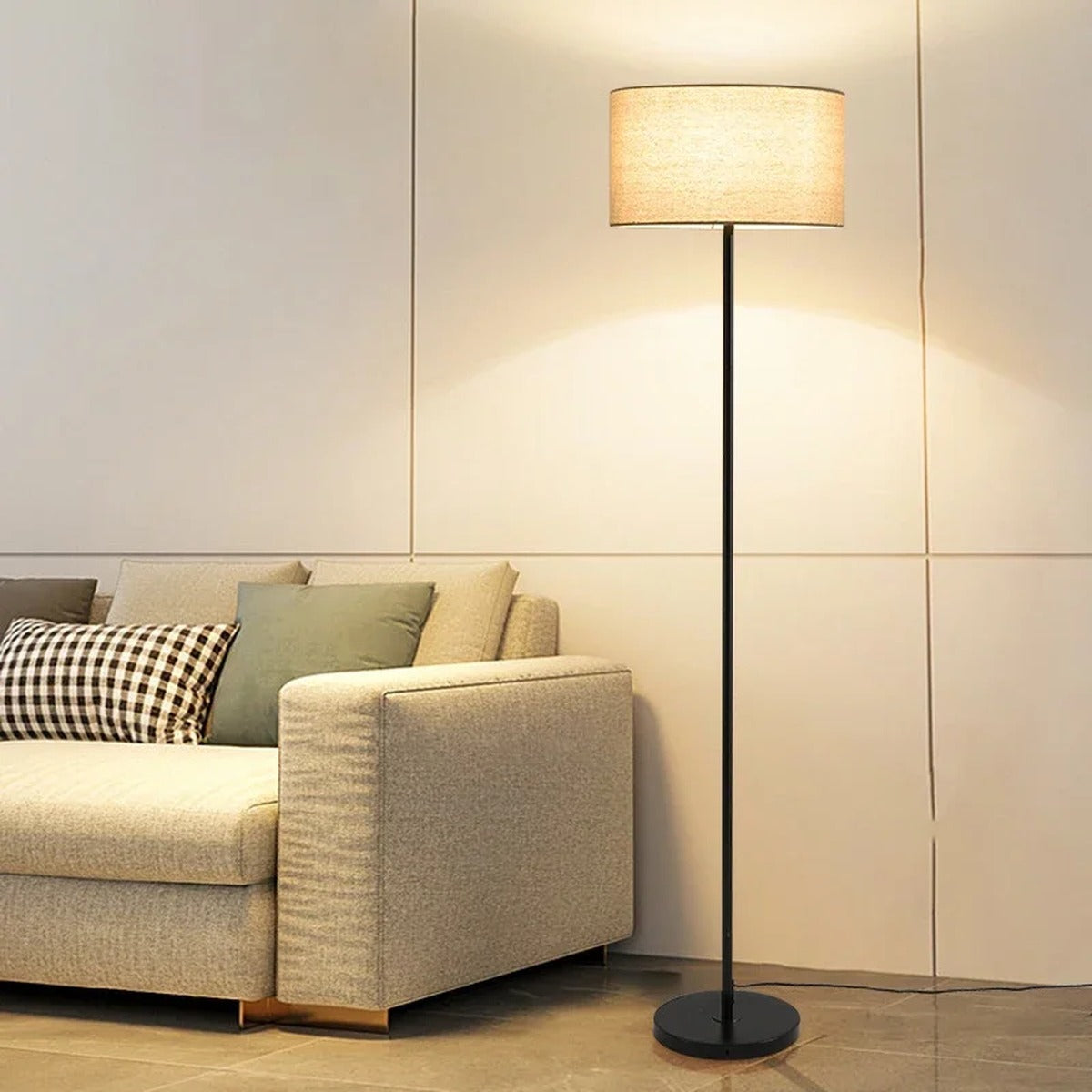 Silent floor lamp — black stem variant beside reading chair