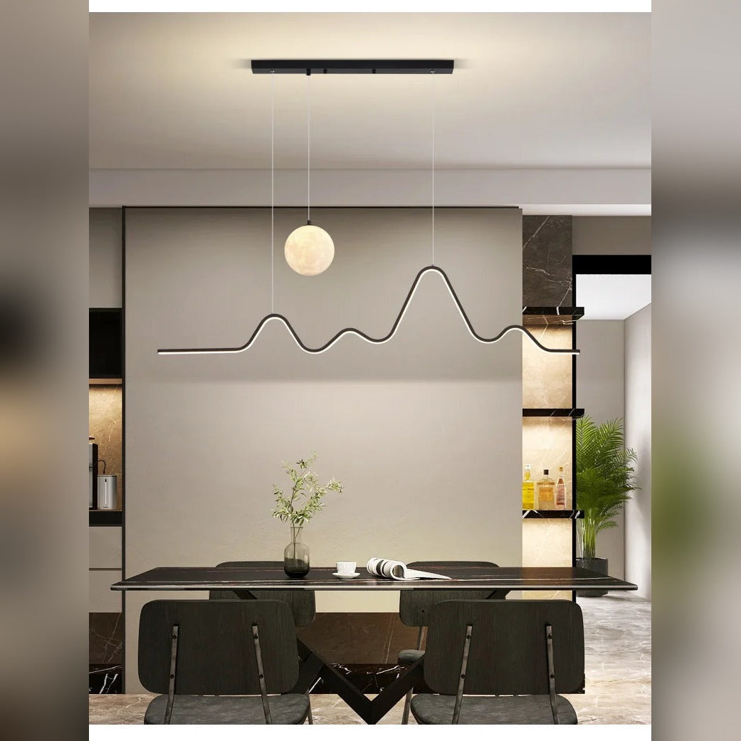 Modern Aluminum Wave Pendant Light with Moon Accent Qraeloria – Black Lifestyle View