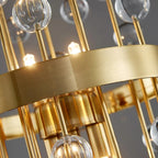 Close-up of Morvena Clear Sphere Crystal glass orbs and brushed brass rods, lit