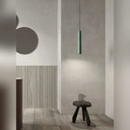 Sage green Nvaelion terrazzo pendant over a bedside stool