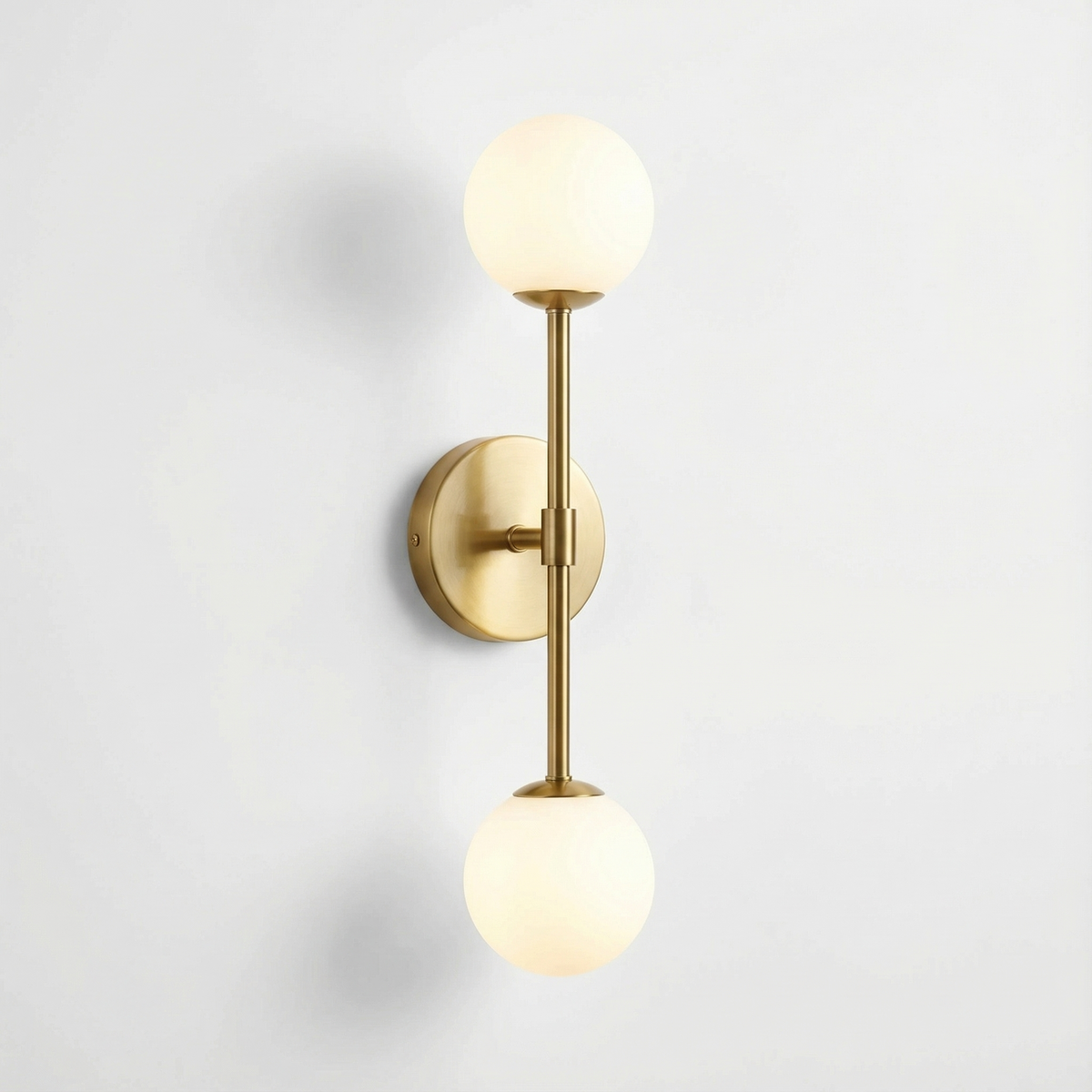 Velaro Twin Globe Wall Sconce – Brass Finish, Studio View