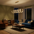 Gold Spiral Crystal Chandelier – Cerix over a living room seating area