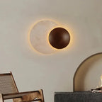 Sculptural Eclipse Wall Sconce Umbrion — living room view