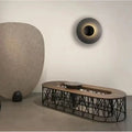 Larleon — in dark corridor as sole light source creating dramatic wall glow