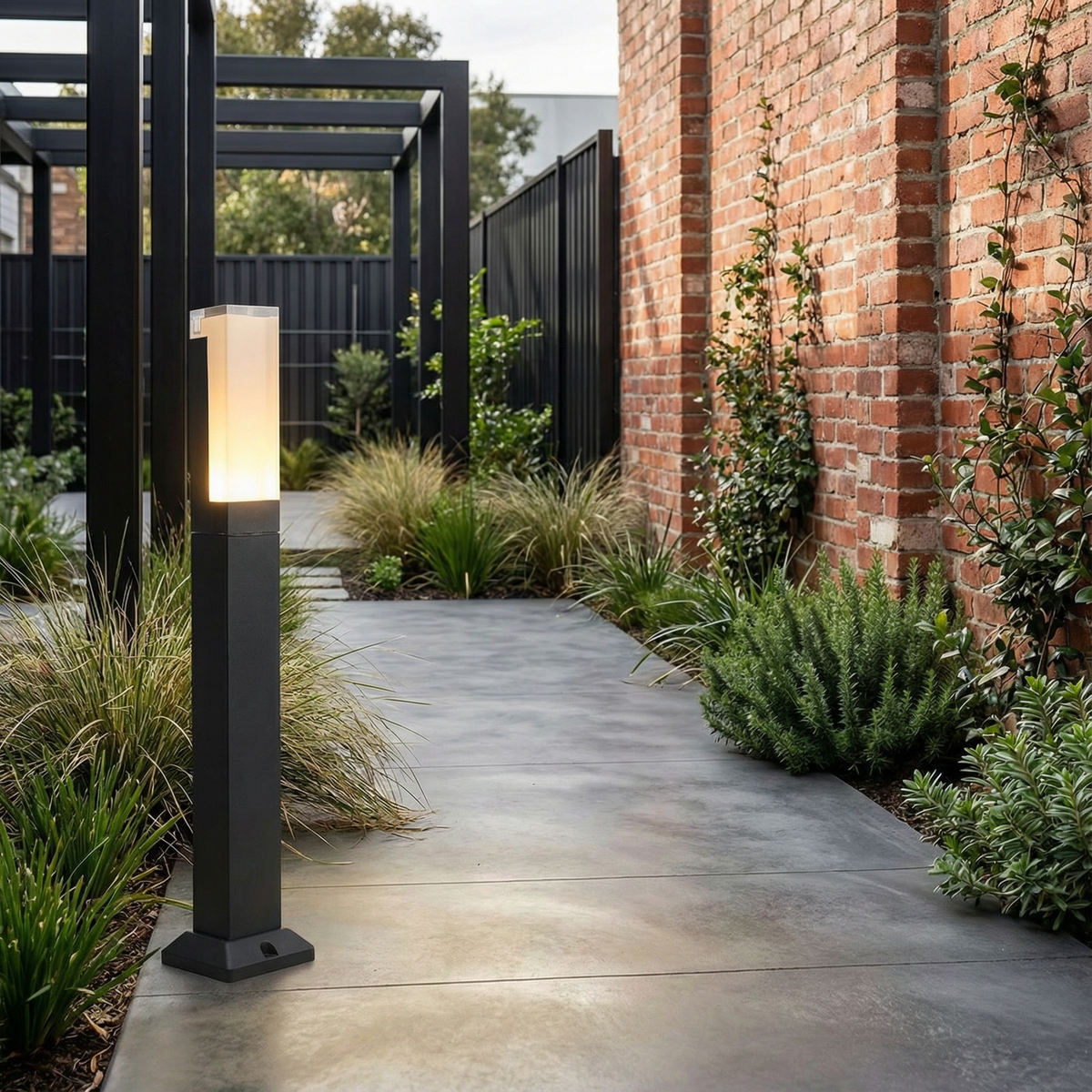Modern Aluminium Garden Path Light Evmora - lining a garden path beside a brick wall