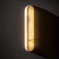 Jenova — close-up of alabaster surface veining and pill-shaped form