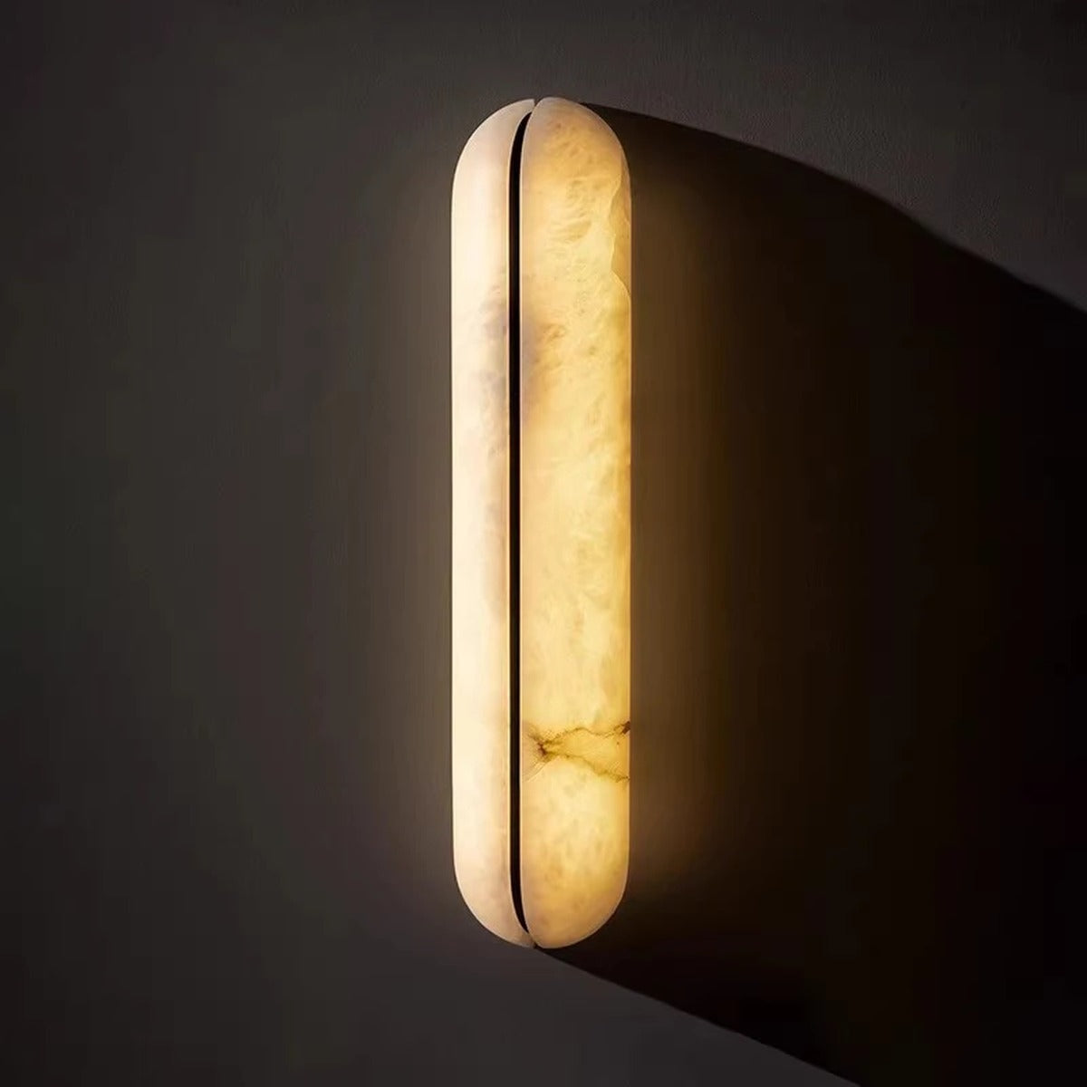 Jenova — close-up of alabaster surface veining and pill-shaped form