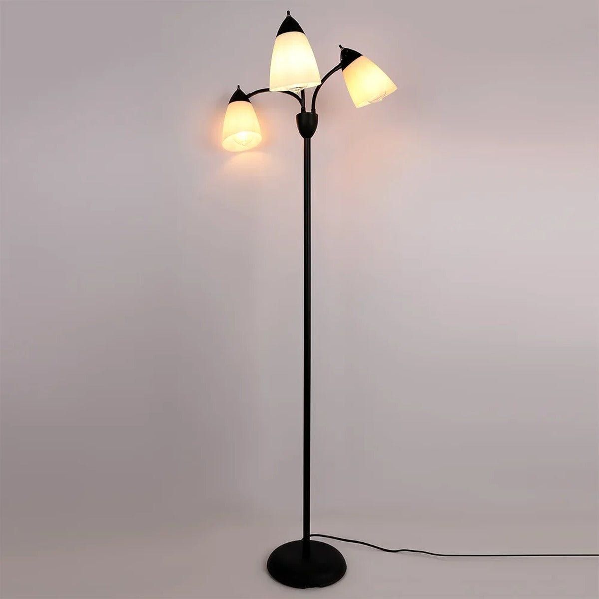 Merelix floor lamp lit with warm white E27 bulbs