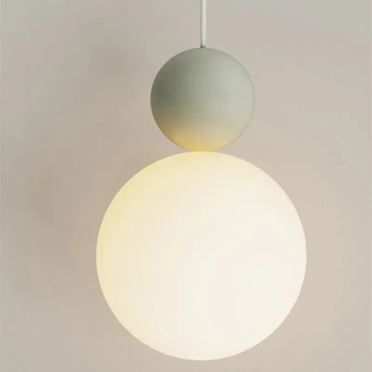 Luniva pendant light — close-up of opal globe and colour cap