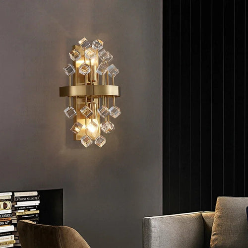 Morvena crystal cluster wall sconce in Clear Cube Crystal, brushed brass frame, living room setting