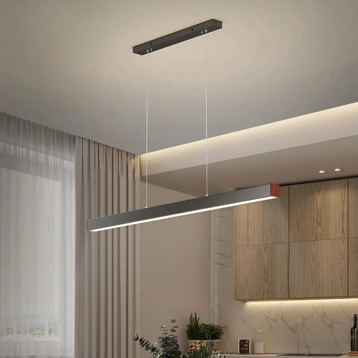 Linexa Black LED Bar Pendant Light above a wood kitchen island