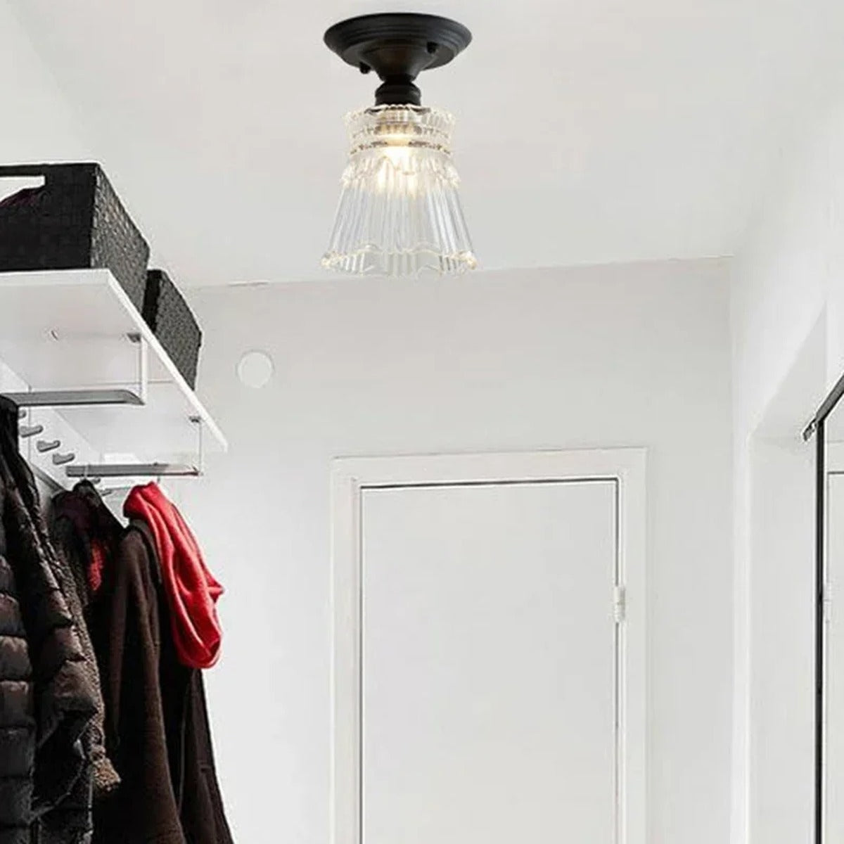 Nostrum vintage ribbed glass dome ceiling light — clear ribbed dome on black Victorian fitting in white minimalist hallway
