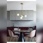 Caeston branching globe chandelier in gold, lifestyle kitchen