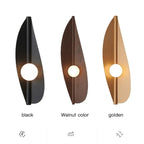 Wabi-Sabi Leaf-Form Wall Sconce Velanthos — Black, Gold and Walnut finishes compared