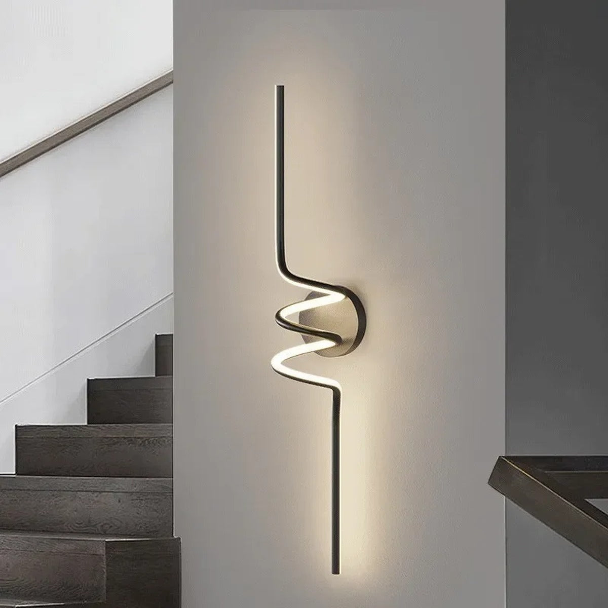 Vireth sculptural ribbon LED wall sconce — corridor lifestyle view
