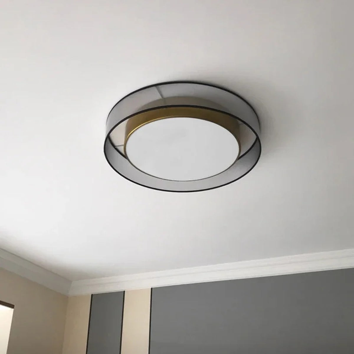 Meridex Round Brass Ring Flush Mount Ceiling Light — lifestyle view in bedroom