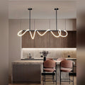 Delvoria sculptural LED pendant light in matte black, Circle mount, kitchen