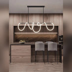 Delvoria sculptural LED pendant light in matte black, Long bar mount, kitchen island