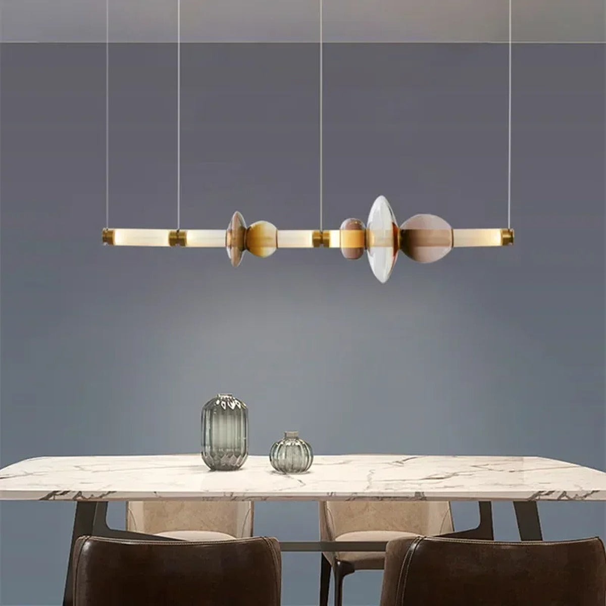 Glass Orb Linear Pendant Light Prismova — over marble dining table, Gold finish