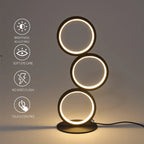 Circolia triple ring LED table lamp in Matte Black, showing touch-control dimming and eye-care glow