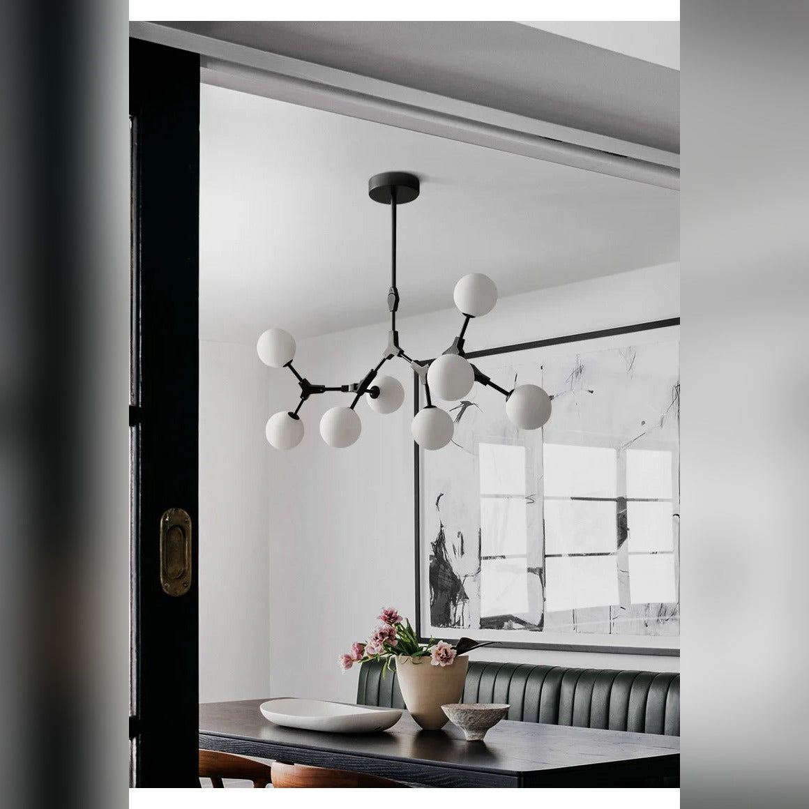 Caeston branching globe chandelier in black, lifestyle dining room