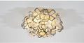 Lumero chandelier, black-edge acrylic petals, illuminated