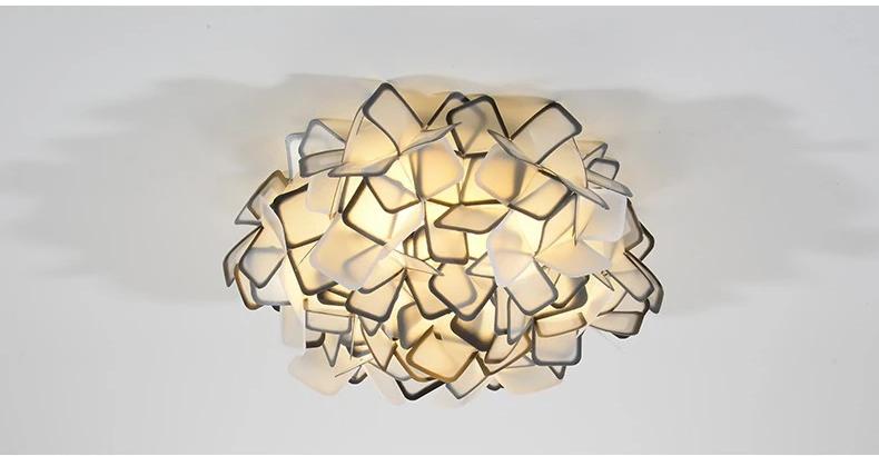 Lumero chandelier, black-edge acrylic petals, illuminated