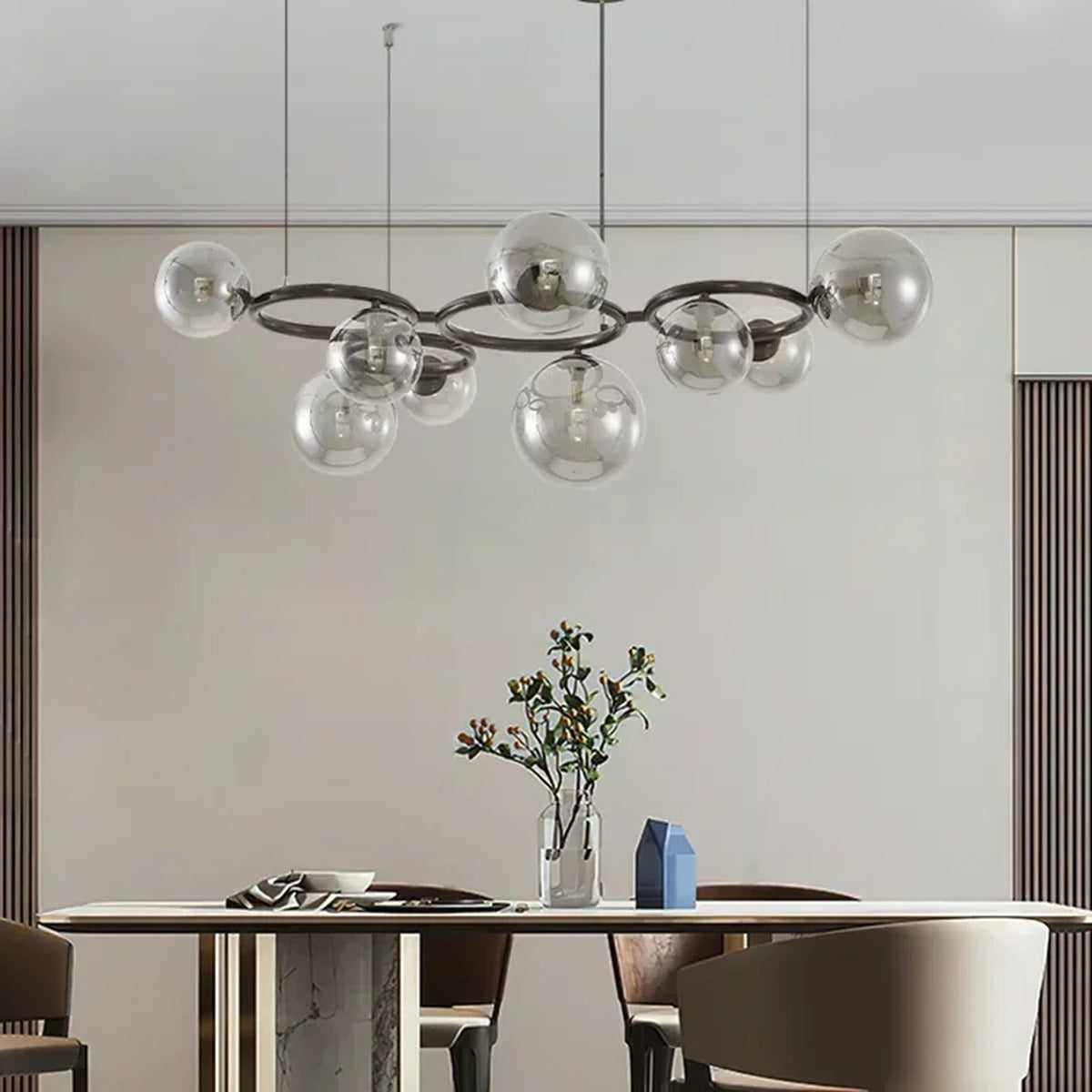 Stellarix Bubble Cluster Chandelier, 9-head transparent glass, above a dining table