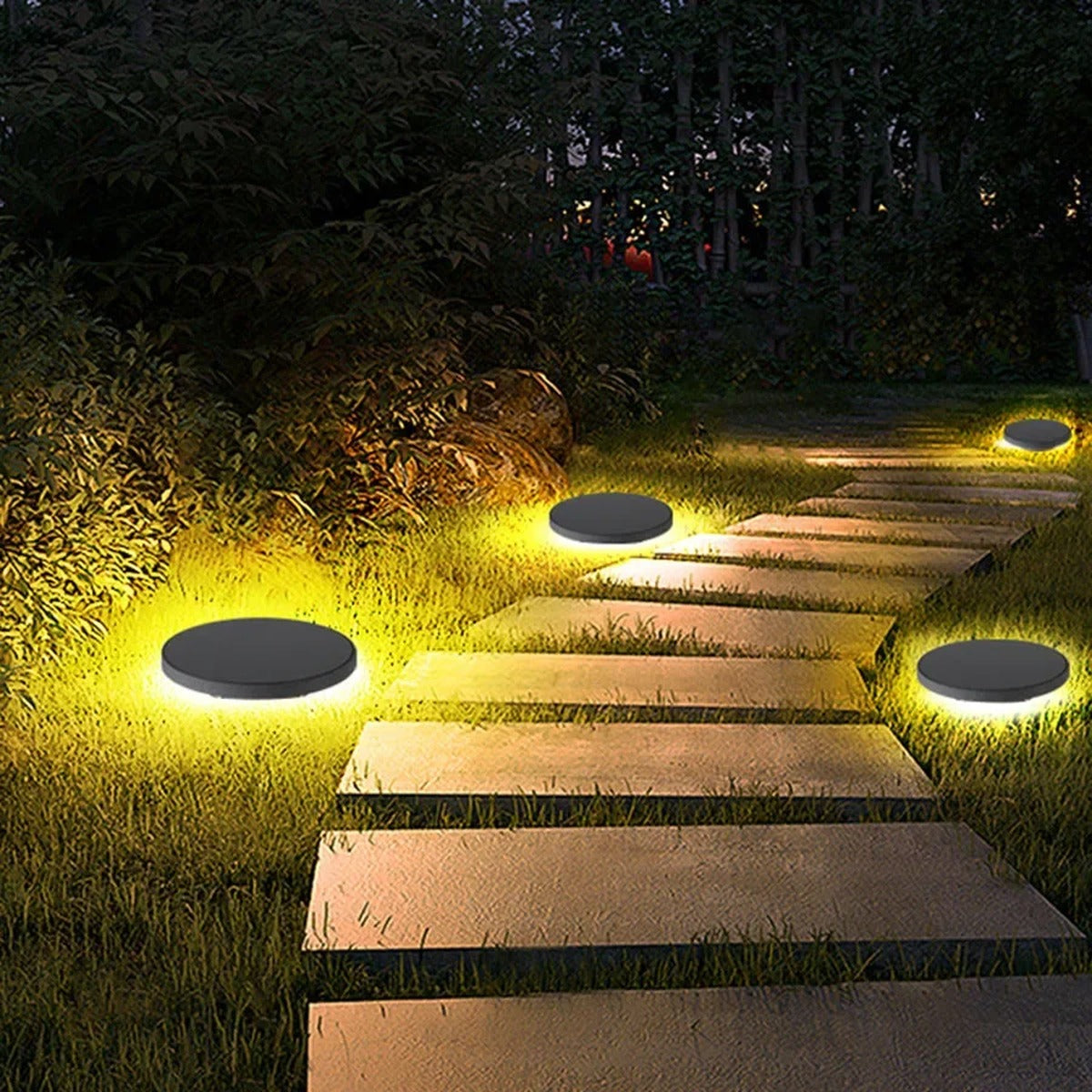 Gathrix dome ground lights beside stone steps and greenery