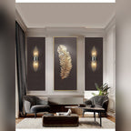 Pair of Aurelix crystal rod wall sconces in matte black flanking artwork